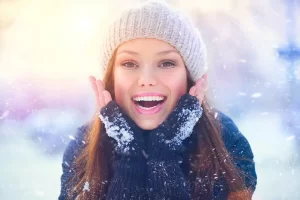 Young women showing her smile in winter