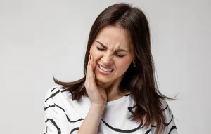 Female with sharp tooth pain in Lancaster, CA