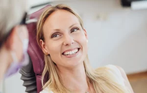 Patient beautiful smile after getting teeth cleaning in Lancaster, CA